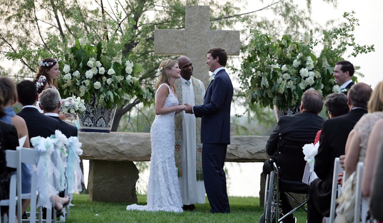 Henry Hager and Jenna Bush exchange vows at the altar Saturday, May 10, 2008, at Prairie Chapel Ranch near Crawford, Texas. Presiding over the wedding ceremony is the Rev. Kirbyjohn Caldwell. 