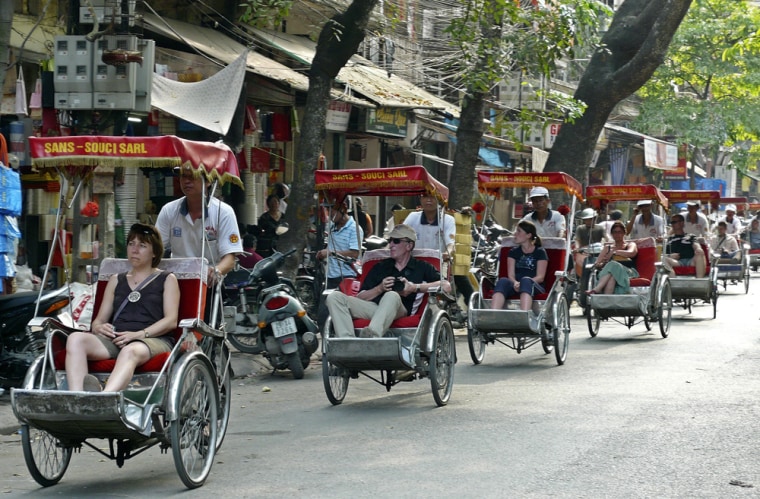 Image: Tourists take in the sites of the Old Quarter neighborhood in Hanoi,Vietnam