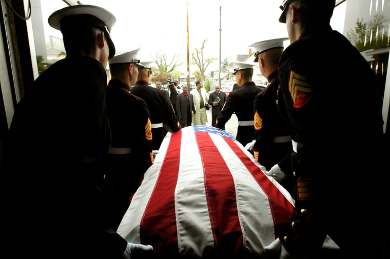 The casket of Marine Lance Cpl. Robert Crutchfield is carried out of Sacrificial Missionary Baptist Church after his funeral service in Cleveland on May 27.