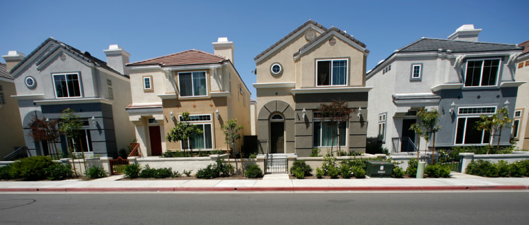 Row homes valued at $400,000 each, which are offered for free in a \"buy one, get one free\" deal, are seen in Escondido