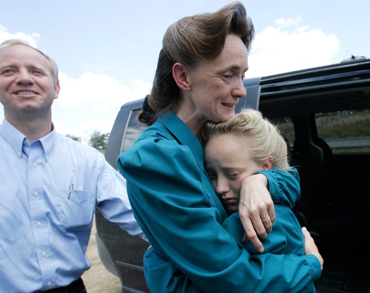 Image: Members of the Fundamentalist Church of Jesus Christ of Latter Day Saints greet their daughter