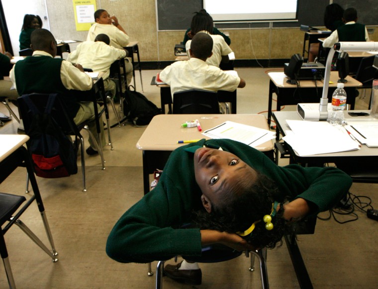 Claudreka Miller stretches during a language arts class at New Orleans College Prep charter school in New Orleans, La., on May 5. Students at the school wear uniforms and have a longer school day. 