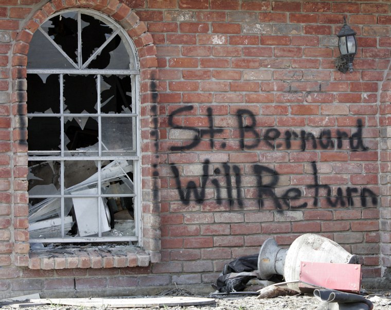 Words of encouragement are written on a house in Meraux, La., which lies in St. Bernard Parish in this 2005 file photo. This New Orleans suburb is still struggling to rebuild since the 2005 hurricane.