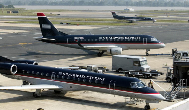 Image: A US Airways jet taxis to the US Airways