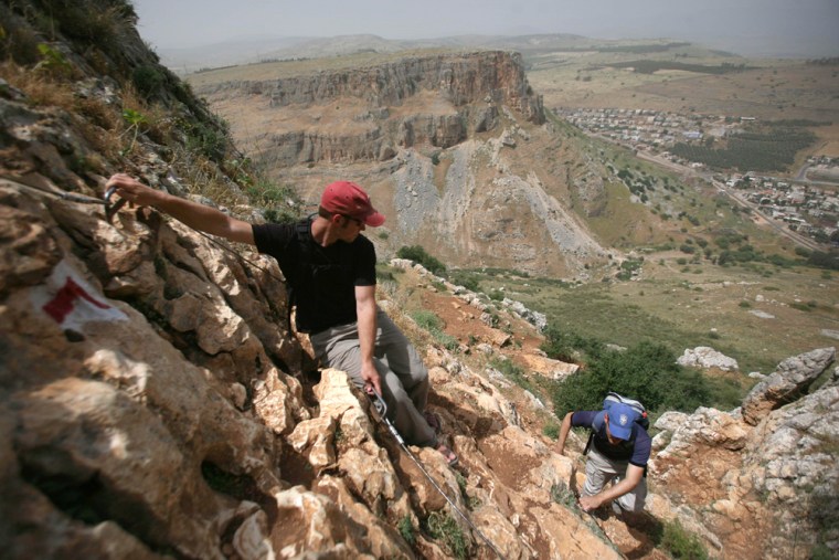 David Landis, left, and Maoz Inon climb the cliffs at the historical site of Arbel along the Jesus Trail in the Galilee region of northern Israel. The two entrepreneurs have built the trail following in the footsteps of Jesus' travels with the hope of attracting thousands of pilgrims from around the world each year. 