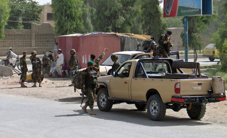 Image: Afghan army soldiers patrol in the southern city of Kandahar