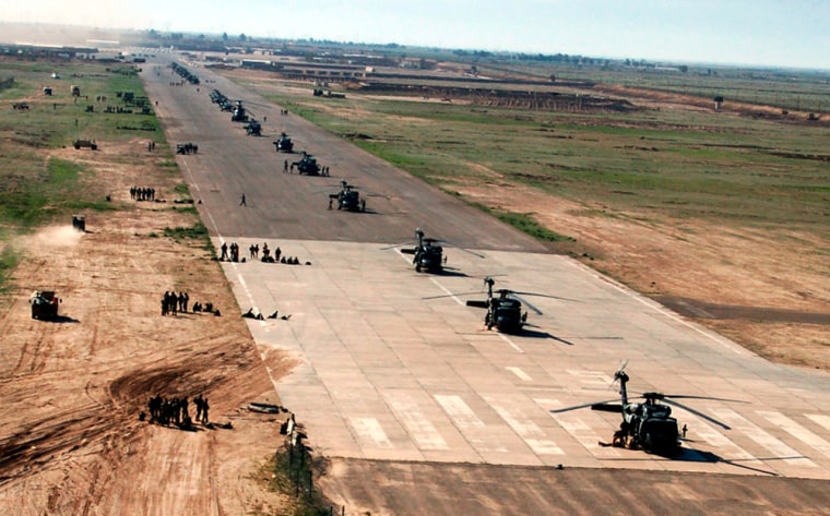 U.S. soldiers and aircraft are positioned on the airstrip at Forward Operating Base Remagen. The future of the U.S. military presence in Iraq is being debated in the halls of Iraq's government.