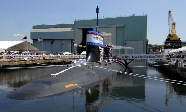 The 7,800-ton, 337-foot nuclear-powered attack submarine New Hampshire awaits christening ceremonies in Groton, Conn., on Saturday. It's the third boat to carry the name of the Granite State.