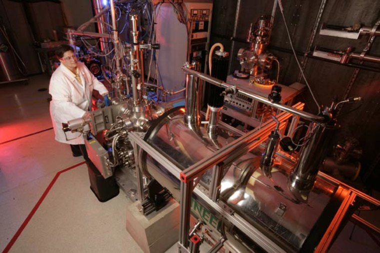 Co-author Jill Scott of Idaho National Laboratory with the laser-based optical and chemical imager (LOCI), which was used to identify organic molecules lodged inside terrestrial jarosite samples. Credit: Idaho National Laboratory