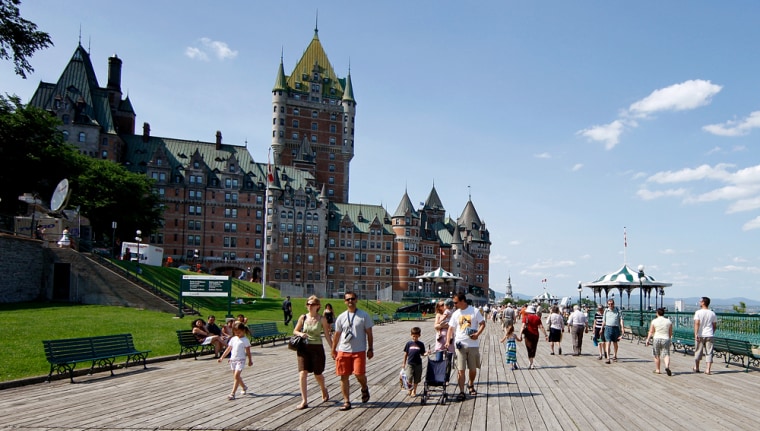 People walk near the Chateau Frontenac in Quebec City