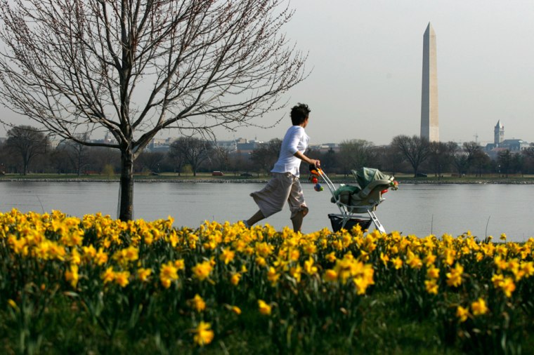 Image: A woman jogs with her baby by George Washington Memorial Parkway