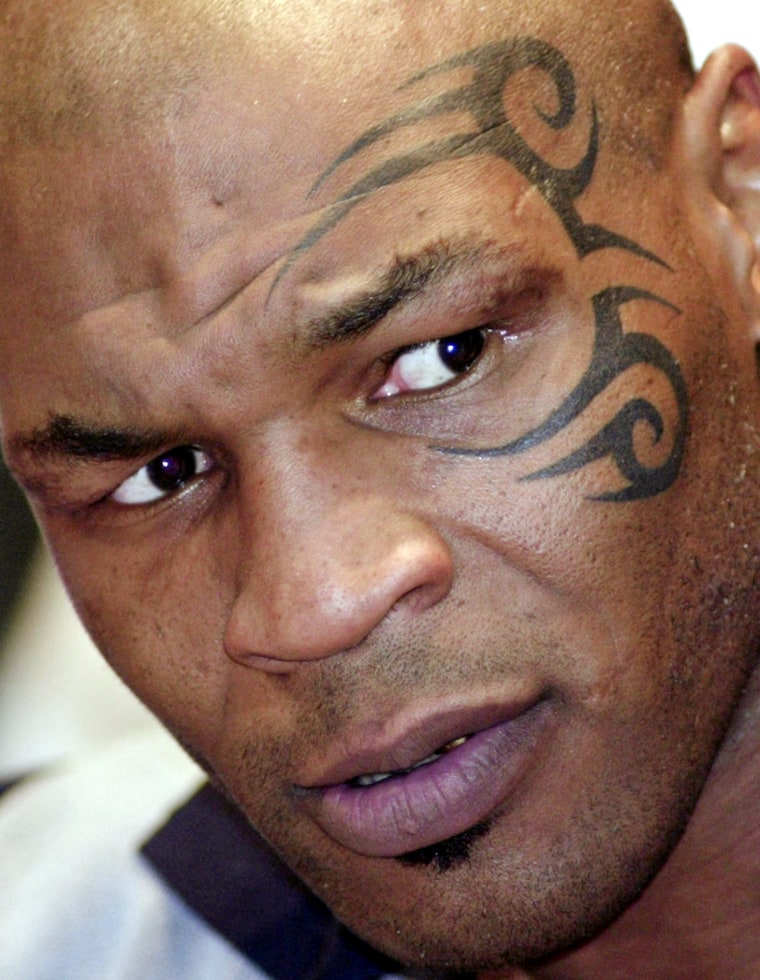 MIKE TYSON LISTENS DURING NEWS CONFERENCE
