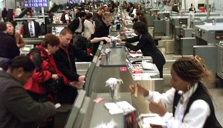 PASSENGERS CHECK IN WITH TICKET AGENTS IN CHICAGO