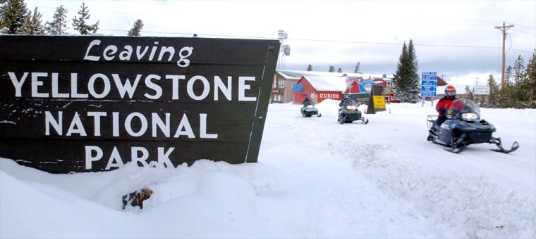 Snowmobilers Ride At Yellowstone National Despite Environmentalists Opposition