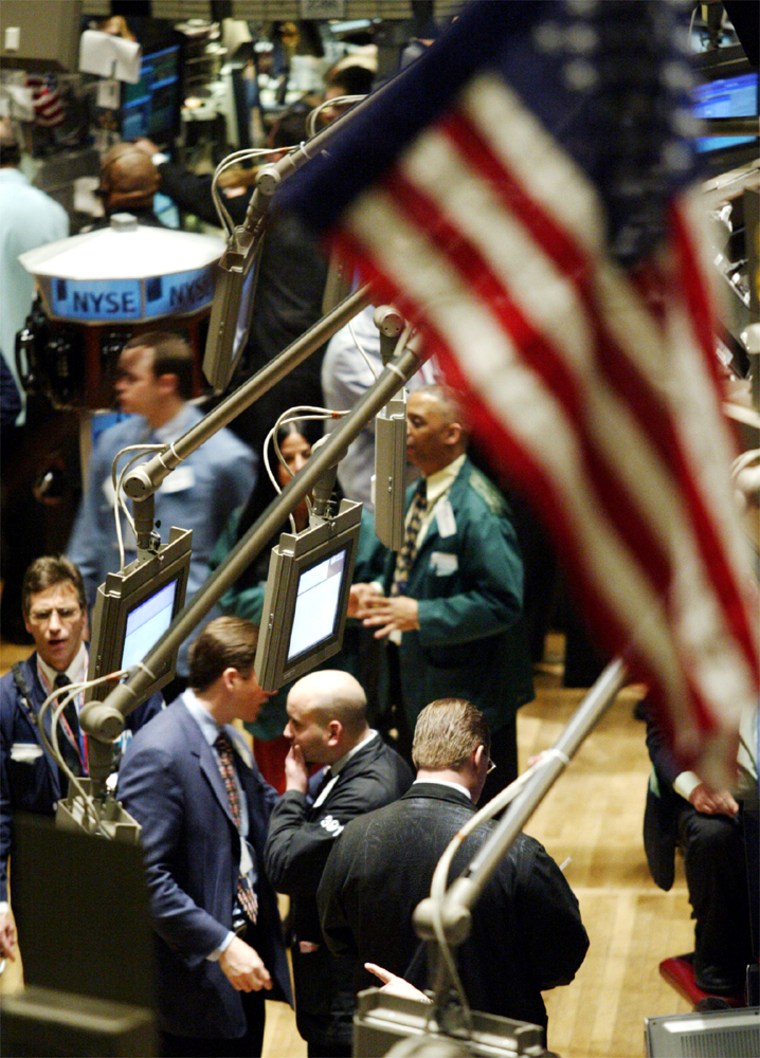 TRADERS WORK ON FLOOR OF NEW YORK STOCK EXCHANGE ON FINAL TRADING DAY BEFORE CHRISTMAS