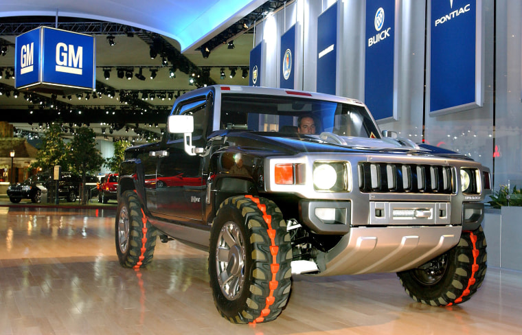 The HUMMER H3T concept vehicle rolls into the Cobo Convention Center for the North American International Auto Show in Detroit Tuesday, Jan. 13, 2004. The H3T was unveiled at the Greater Los Angeles Auto Show in December. (AP Photo/General Motors, Joe Polimeni, HO)