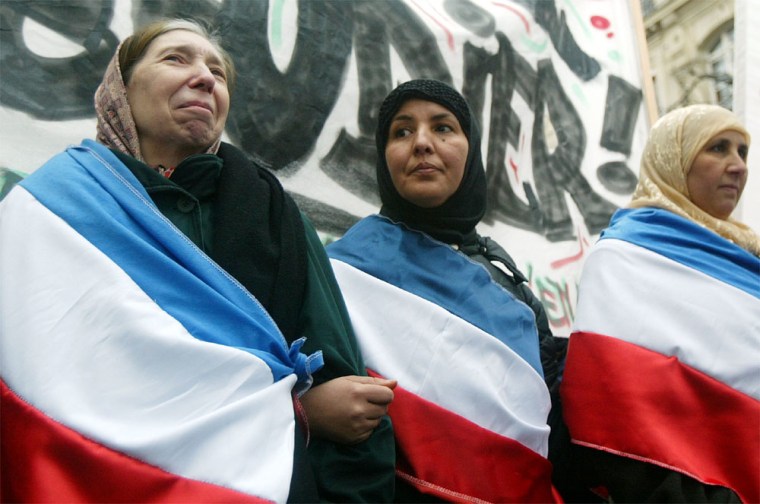 Muslims Rally Against France's Ban On Religious Headscarves