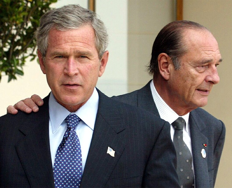 FRENCH PRESIDENT CHIRAC PUTS HAND ON US PRESIDENT BUSH'S SHOULDER