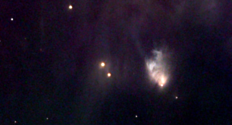 McNeil's Nebula is the fuzzy cloud toward the right side of this picture, which was made at the Kitt Peak Observatory in Arizona using a 20-inch telescope.