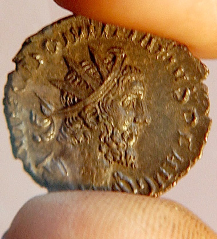 COIN WHICH DISPLAYS HEAD OF VIRTUALLY UNKNOWN ROMAN RULER  DOMITIANUS IS SHOWN