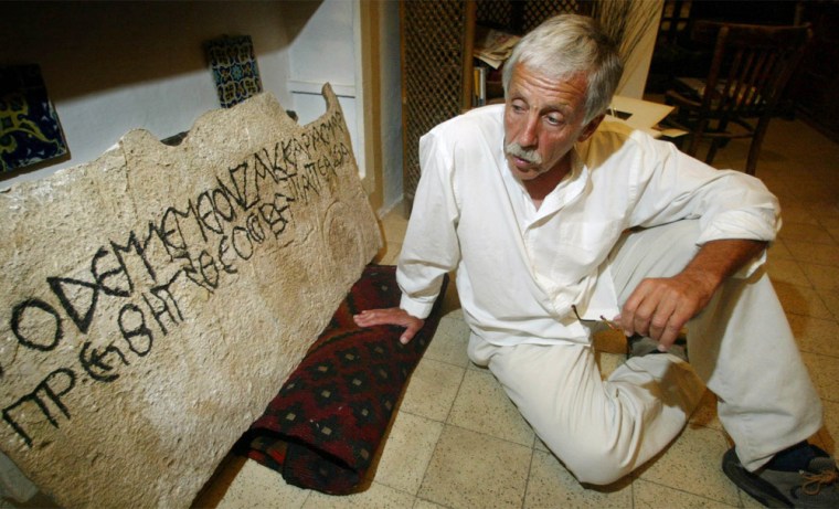 Physical anthropologist Joe Zias, looks at a cast he made of a Greek inscription discovered on the stone facade of an ancient burial monument at the foot of Jerusalem's Mount of Olives Saturday June 14, 2003. The 47-letter text reads \"This is the tomb of Zachariah, martyr, very pious priest, father of John\", an apparent reference to the father of John the Baptist. (AP Photo/Rick Bowmer)