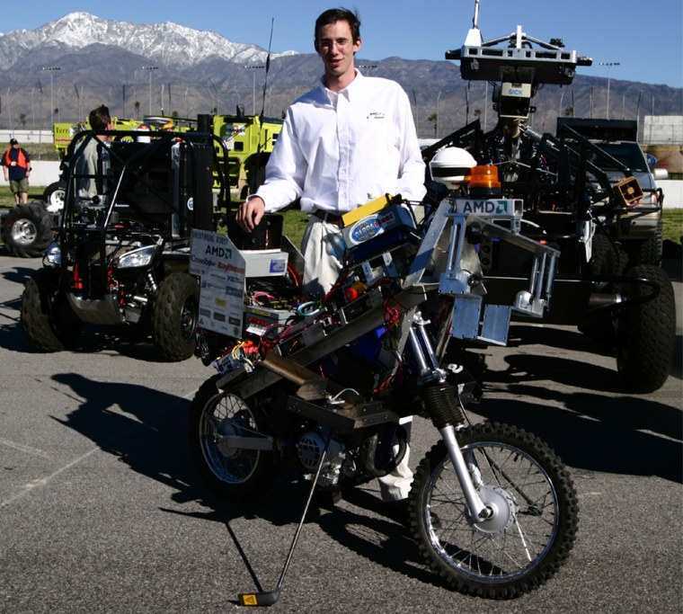 March 8, 2004 - California Speedway, Fontana, California - Blue Team leader Anthony Levandowski with \"Dexterit\", the world's first autonomous single-track vehicle. during qualifying trials for the DARPA Grand Challenge.