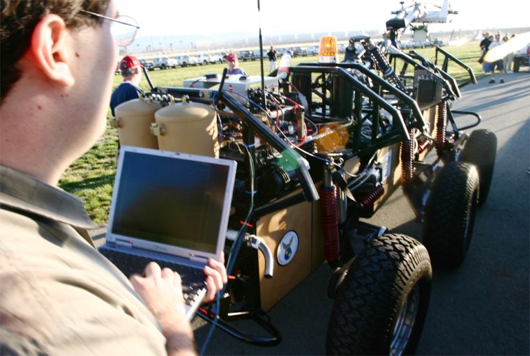 Denny Gudea uses a laptop to drive "Terrahawk" on the first day of testing and qualifying for the DARPA Grand Challenge.