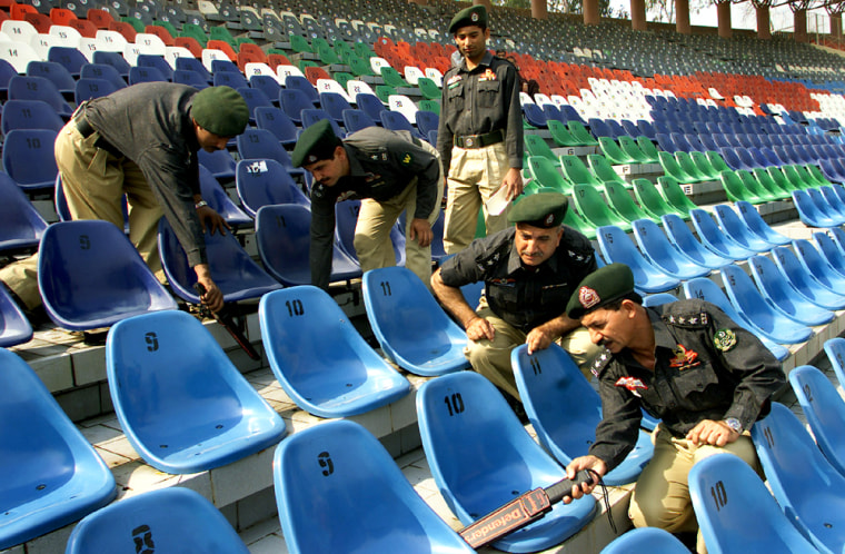 PAKISTANI SECURITY OFFICERS INSPECT SEATS OF STADIUM IN LAHORE