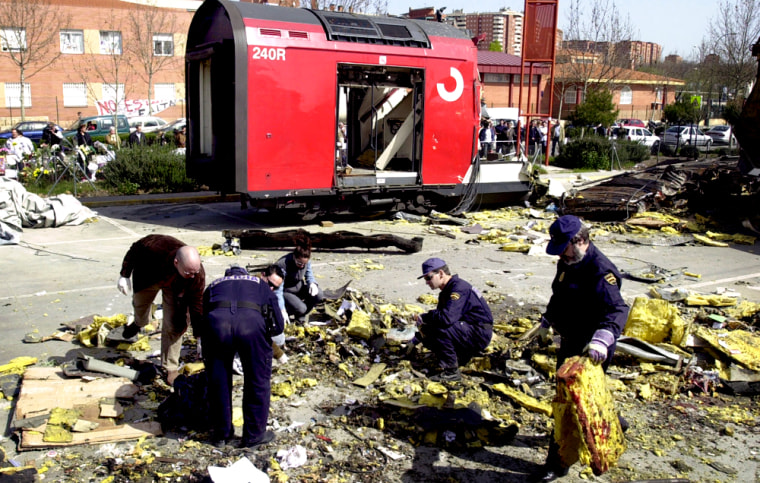Police search for clues from the debris of one of the train bombings in the Madrid suburb of El Pozo on March 15. 