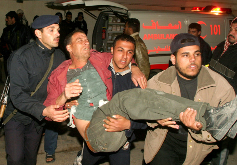 Palestinians carry a man wounded in an Israeli air force missile strike into the emergency area of Najar Hospital in the Rafah refugee camp, southern Gaza Strip, on Wednesday.