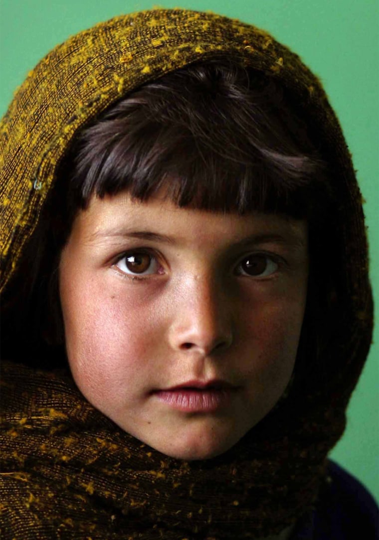 March 15, 2004 Yet another city once destroyed by the Taliban, Karabagh is trying to remend.&nbsp; With a recently opened medical clinic and its vibrant market area, the residents of this small area are attempting to rebuild what once was lost.&nbsp;&nbsp;&nbsp;&nbsp; Portrait of a young Karabagh village resident as she waits, with her mother, for medical treatment for her younger sibling at the village medical clinic.&nbsp; StaffPhoto imported to Merlin on&nbsp; Tue Mar 16 06:30:09 2004