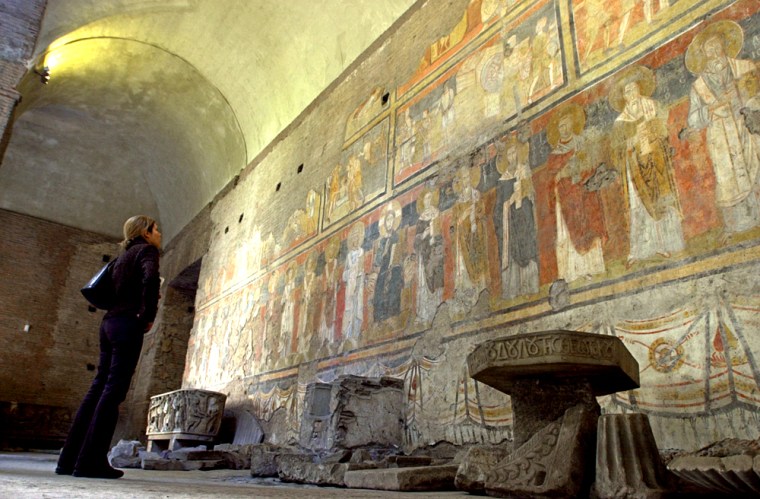 A visitor looks at a fresco, Christ on throne with Saints, believed to date back to 757 A.D., in Santa Maria Antiqua -- the oldest Christian structure in the Roman Forum.