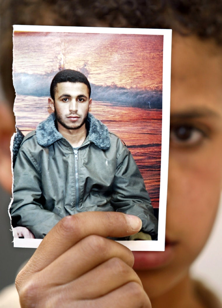 FRIENDS MOURN WITH PICTURE OF PALESTINIAN SUICIDE BOMBER FADI AL-AMUDI
