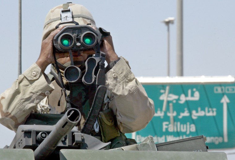 A U.S. soldier surveys his surroundings near one entrance to Fallujah earlier this week.