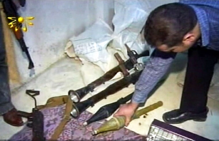 SYRIAN SECURITY FORCES HANDLE ARMS CACHE IN MAKESHIFT DEPOT IN DAMASCUS