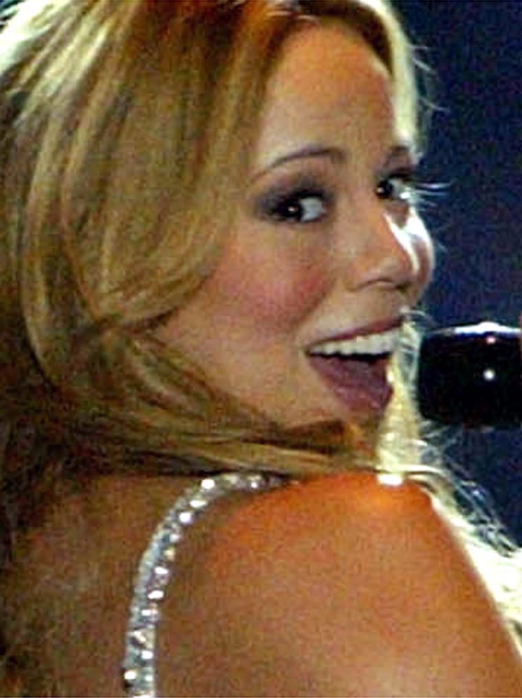 American singer Mariah Carey performs during a concert in Beirut, Lebanon Tuesday Feb. 24, 2004. Carey was in Beirut for only one show. (AP Photo )