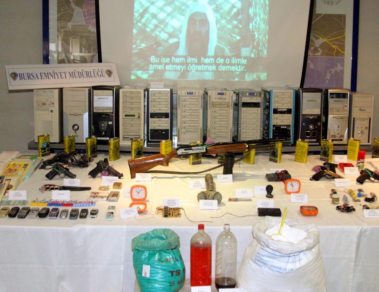 TURKISH POLICE DISPLAY SEIZED GUNS EXPLOSIVES AND A FILM ON BIN LADEN