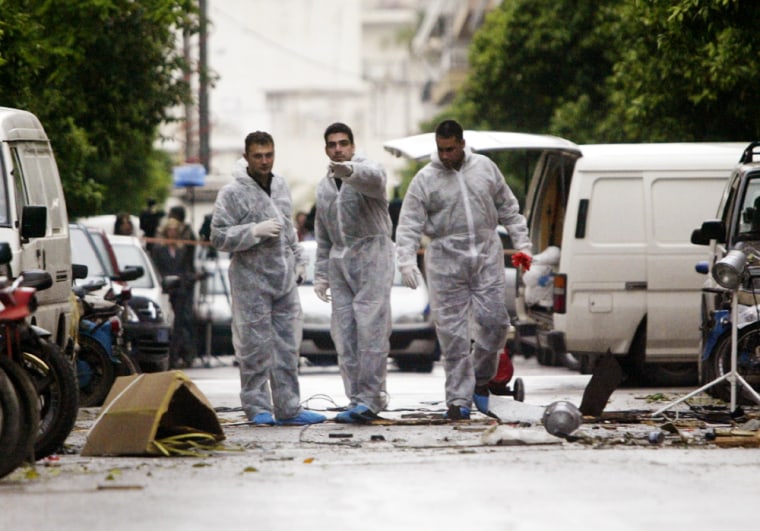 GREEK POLICE EXPERTS CHECK FOR EVIDENCE AFTER TRIPLE BOMB BLASTS IN ATHENS