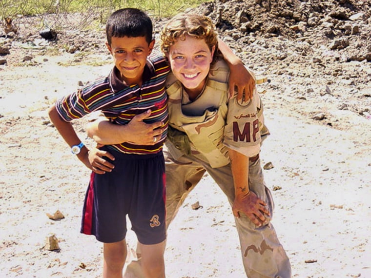 An undated family handout photo obtained by the Washington Post shows Army Specialist Sabrina D. Harman with a young Iraqi boy in Al Hillah., Iraq.  Harman is among those charged with abuse of Iraqi detainees at Abu Ghraib prison.