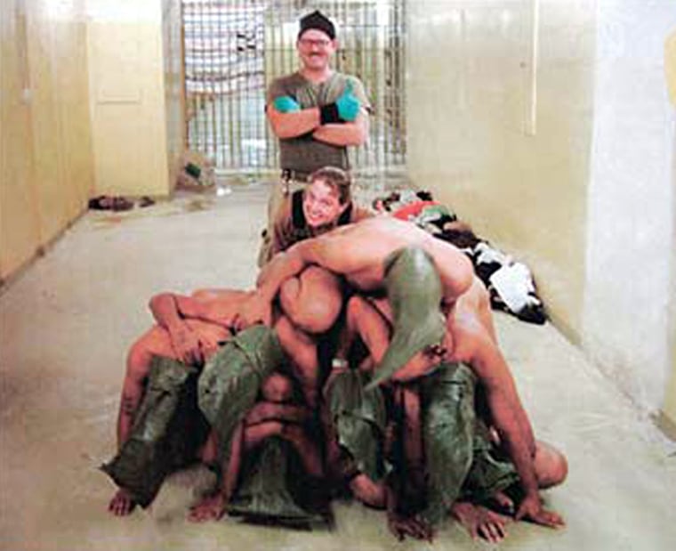 Harman is among the soldiers who posed with Iraqi detainees. She is accused by the Army of videotaping prisoners who were ordered to strip.