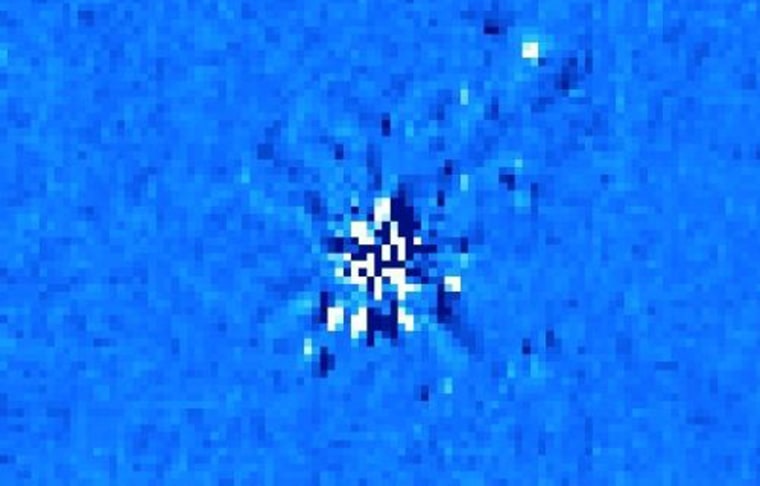 In this highly processed image of a distant white dwarf star, the glare of the star itself has been reduced, revealing a point of infrared light toward the upper right that may be a planet or a brown dwarf. Additional observations are likely to show whether the object moves with the white dwarf and is a companion, or if it is a background object moving at a different pace.