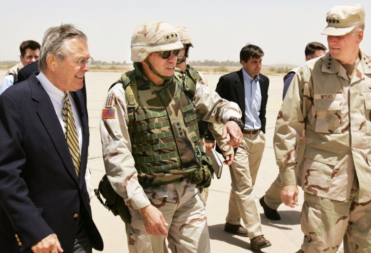 Defense Secretary Donald Rumsfeld, left, arrives Thursday with the commander of the coalition forces in Iraq, Lt. Gen. Ricardo Sanchez, center, and Gen. Richard Myers, chairman of the Joint Chiefs of Staff, at the Baghdad airport.