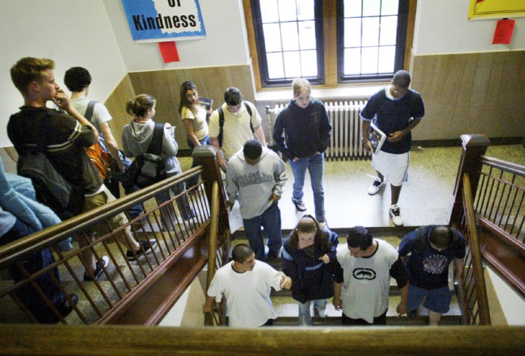 The students of High School make their way through the stairwell after the final bell of the day in , Kan., April 29.