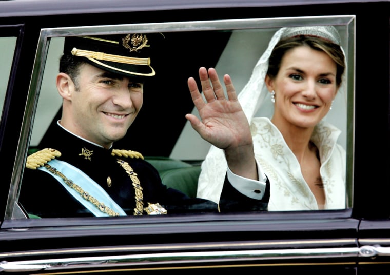 SPANISH CROWN PRINCE FELIPE AND PRINCESS LETIZIA WAVE TO WELL WISHERS DURING TOUR THROUGH MADRID