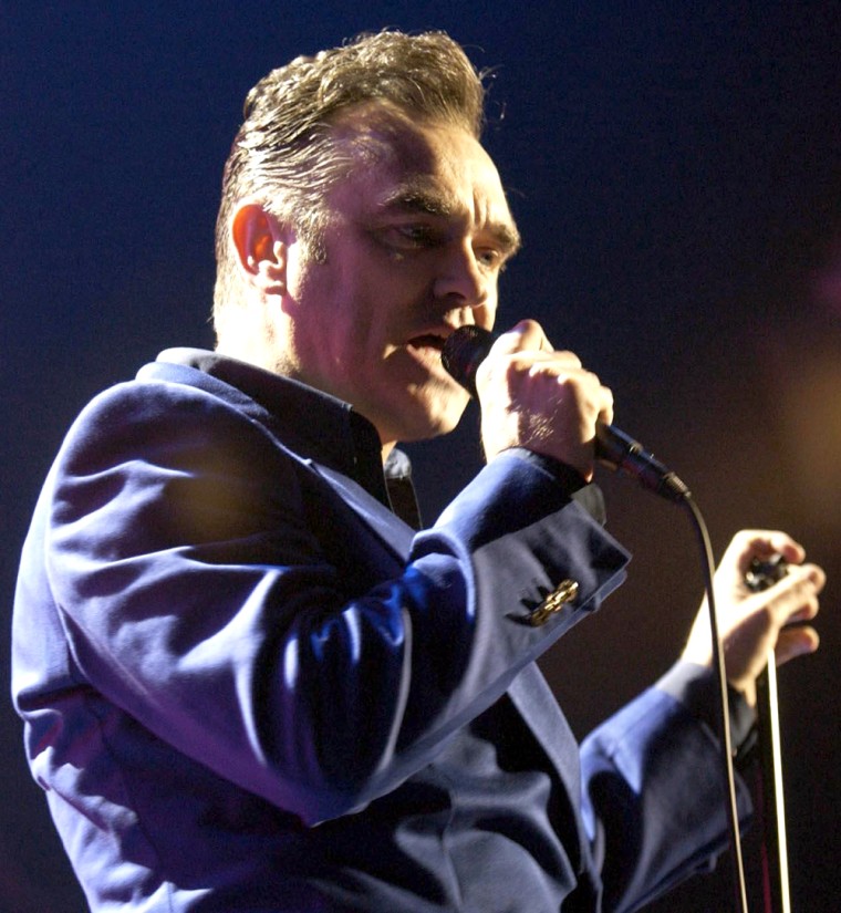 Morrissey performs on stage during a concert to promote his new album - You Are The Quarry - at the Manchester Evening News Arena in Manchester, England, Saturday, May 22, 2004. (AP Photo/PA, Yui Mok ) ** UNITED KINGDOM OUT NO SALES MAGS OUT **