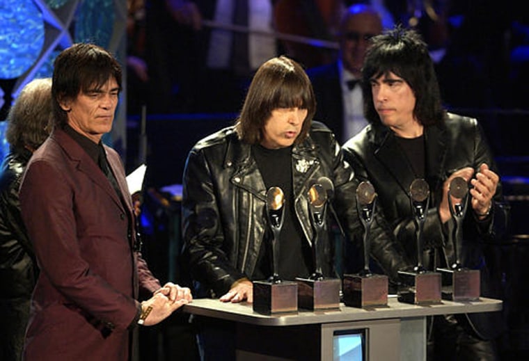 “God bless President Bush, and God bless America!” shouted Johnny Ramone, center, flanked by Dee Dee Ramone, left, and Marky Ramone at the Ramones’ induction into the Rock and Roll Hall of Fame in March 2002. Johnny Ramone's statement pointed to the growing impact of conservatism on younger voters.