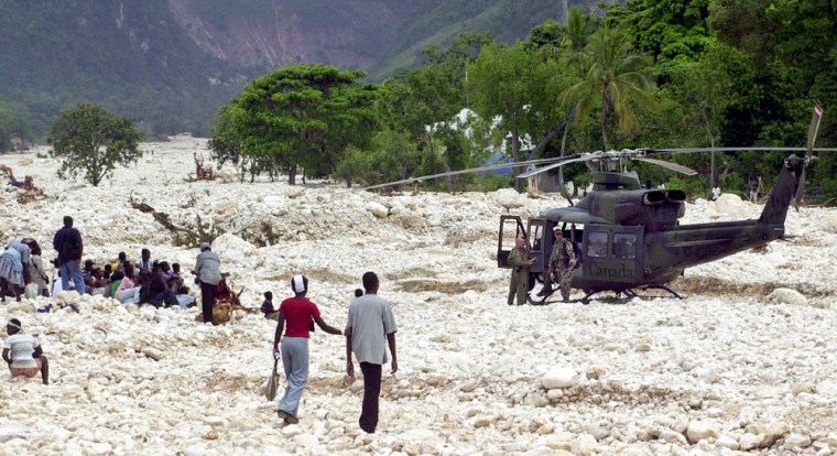 A CANADIAN HELICOPTER LANDS WHERE THE FOND VERRETTES MARKET USED TO STAND