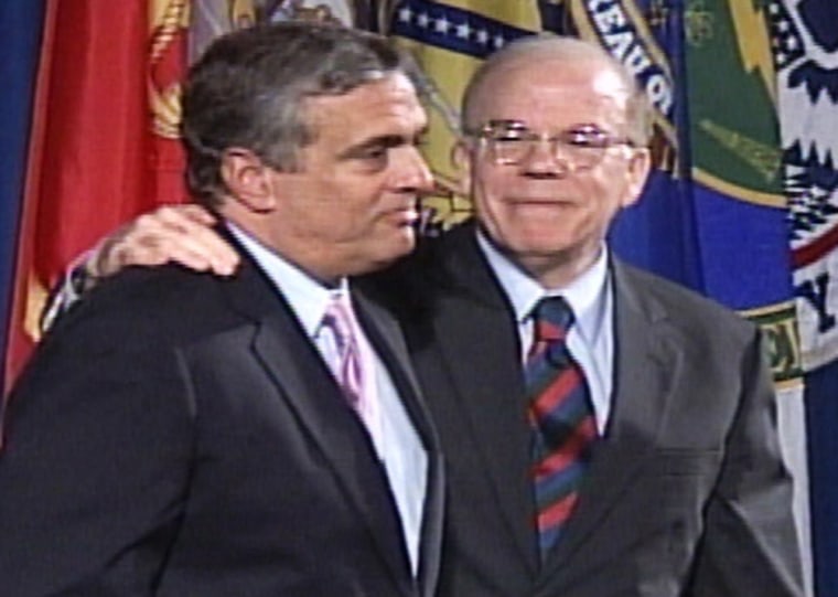 FRAME GRAB IMAGE OF CIA DIRECTOR TENET IS HUGGED BY ACTING DIRECTOR JOHN MCLAUGHLIN