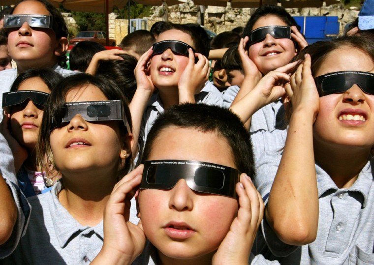 LEBANESE SCHOOLCHILDREN  WATCH THE PLANET VENUS PASS ACROSS THE SUN IN ALAY VILLAGE IN ON MOUNT LEBANON