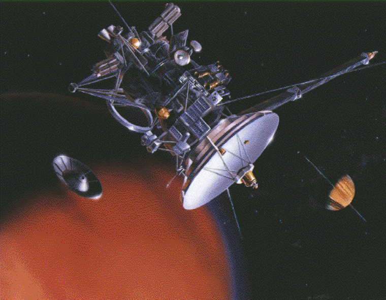 An artist's conception shows the Cassini spacecraft flying by the moon Titan and releasing its Huygens lander, with Saturn in the background. Cassini is due to arrive at Saturn on Wednesday.